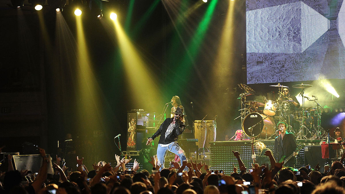 In this file photo taken on 9 March, 2012 singer Axl Rose, Bassist DJ Ashba, Guitarist Ron Tha, and Tommy Stinson of Guns N` Roses performs at the Hollywood Palladium in Hollywood, California. Photo: AFP