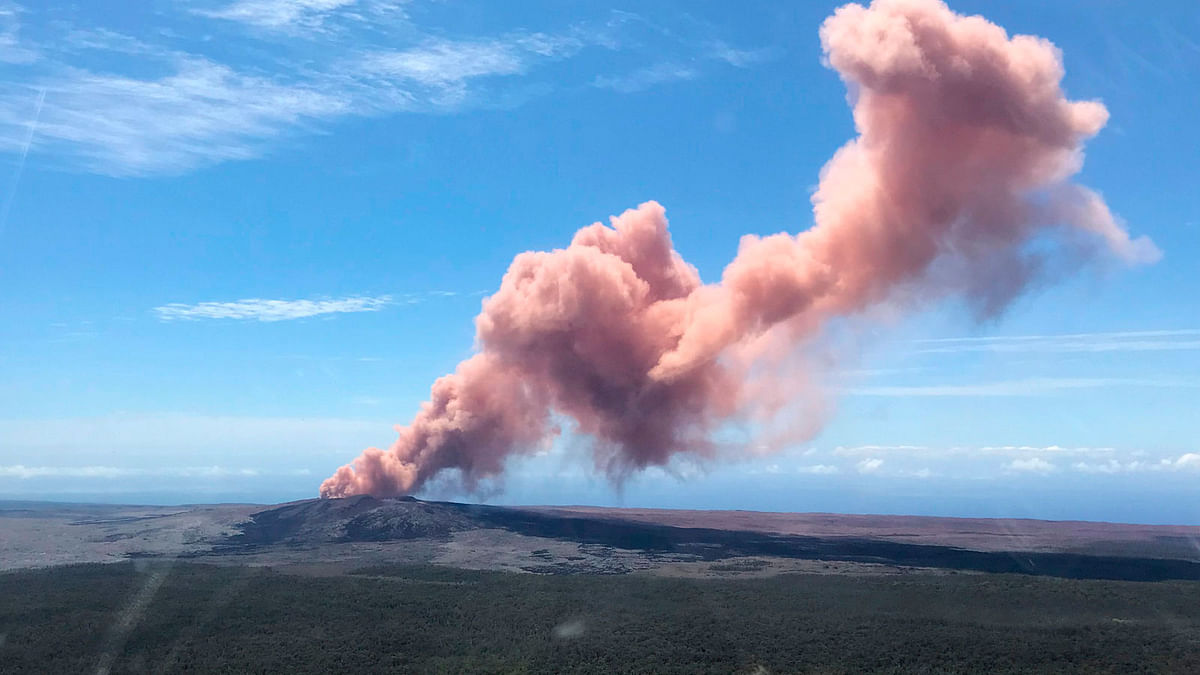 In this photo provided bt the US Geological Survey, an ash plume rises above the Kilauea volcano on Hawaii's Big Island on 3 May 2018. AFP