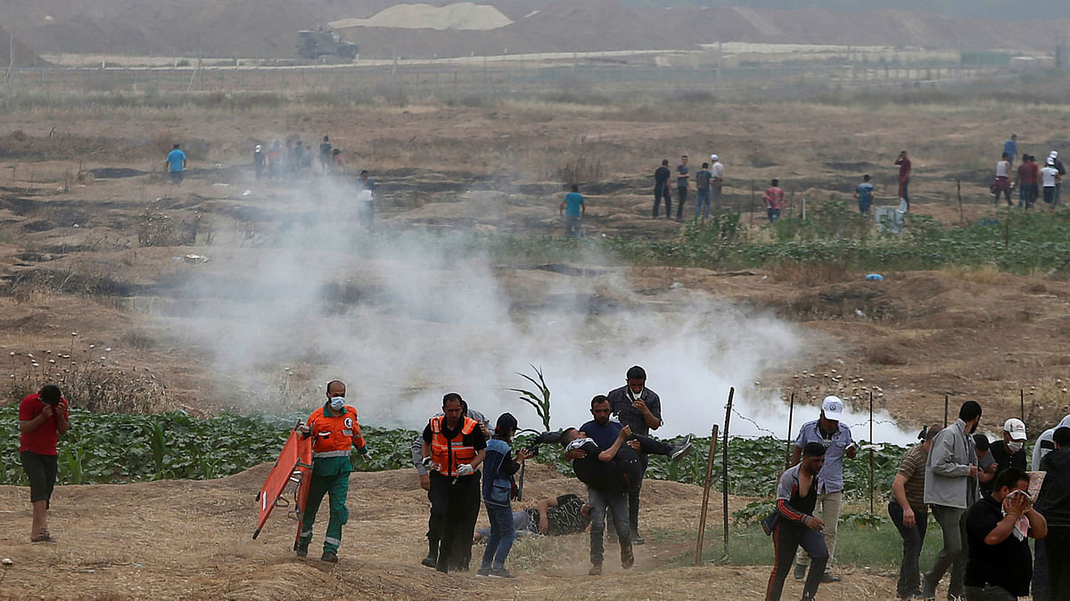 Wounded demonstrator is evacuated during a protest where Palestinians demand the right to return to their homeland, at the Israel-Gaza border, east of Gaza City. Reuters