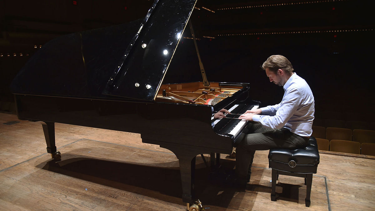 Norwegian pianist Leif Ove Andsnes plays the piano in the David Geffen Hall, in Lincoln Center, in New York City on 2 May. Photo: AFP  Norwegian pianist in quest for a perfect mood