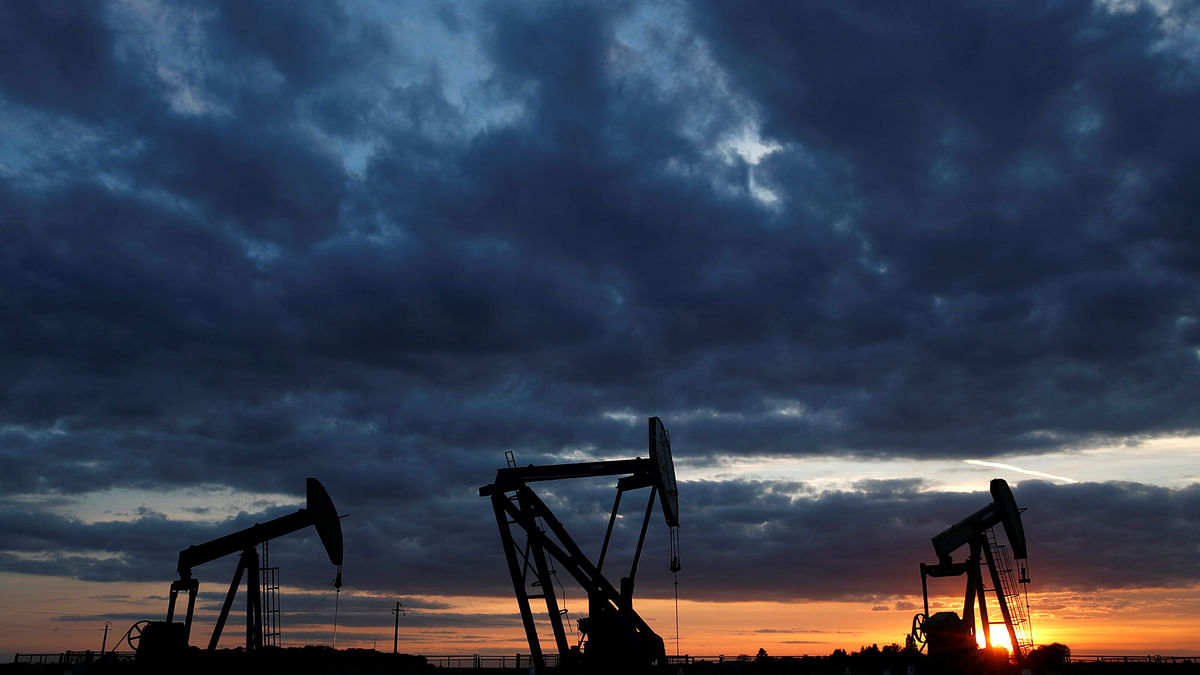 Oil pumps are seen at sunset outside Vaudoy-en-Brie, near Paris, France on 23 April. Photo: Reuters