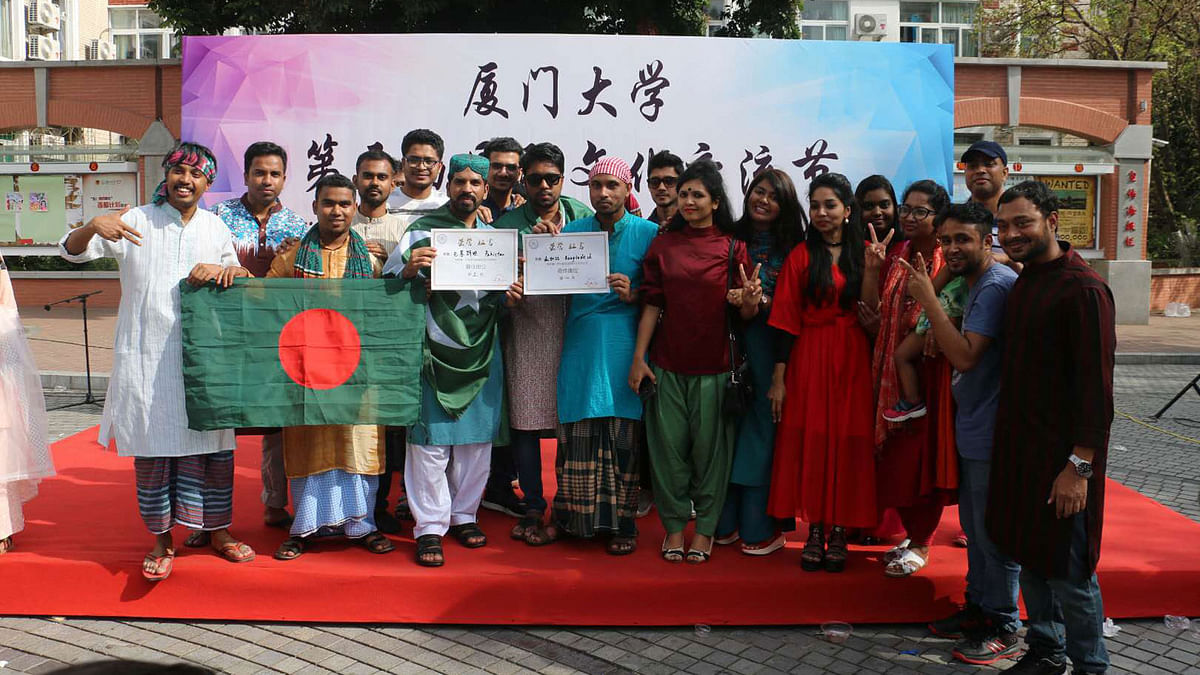 Bangladeshi students are photographed during the food festival. Photo: Collected