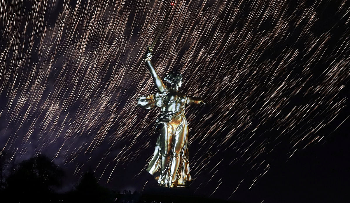 Fireworks explode over the statue Motherland Calls, a World War Two memorial located on the top of Mamayev Kurgan hill, during a light and laser show dedicated to the 73rd anniversary of the victory over Nazi Germany in World War Two, in Volgograd, Russia, 8 May 2018. Reuters
