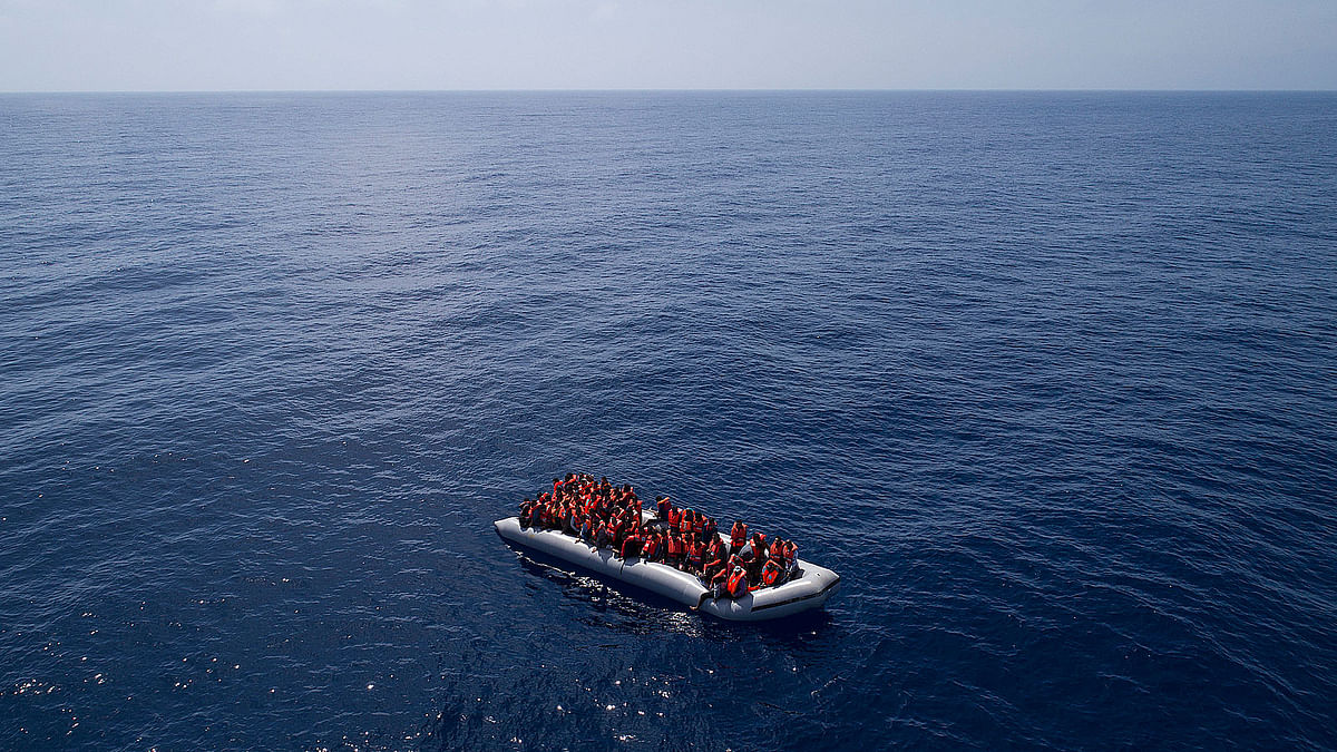 Refugees and migrants are rescued by members of the Spanish NGO Proactiva Open Arms, after leaving Libya trying to reach European soil aboard an overcrowded rubber boat, north of Libyan coast on Sunday, 6 May 2018. AP