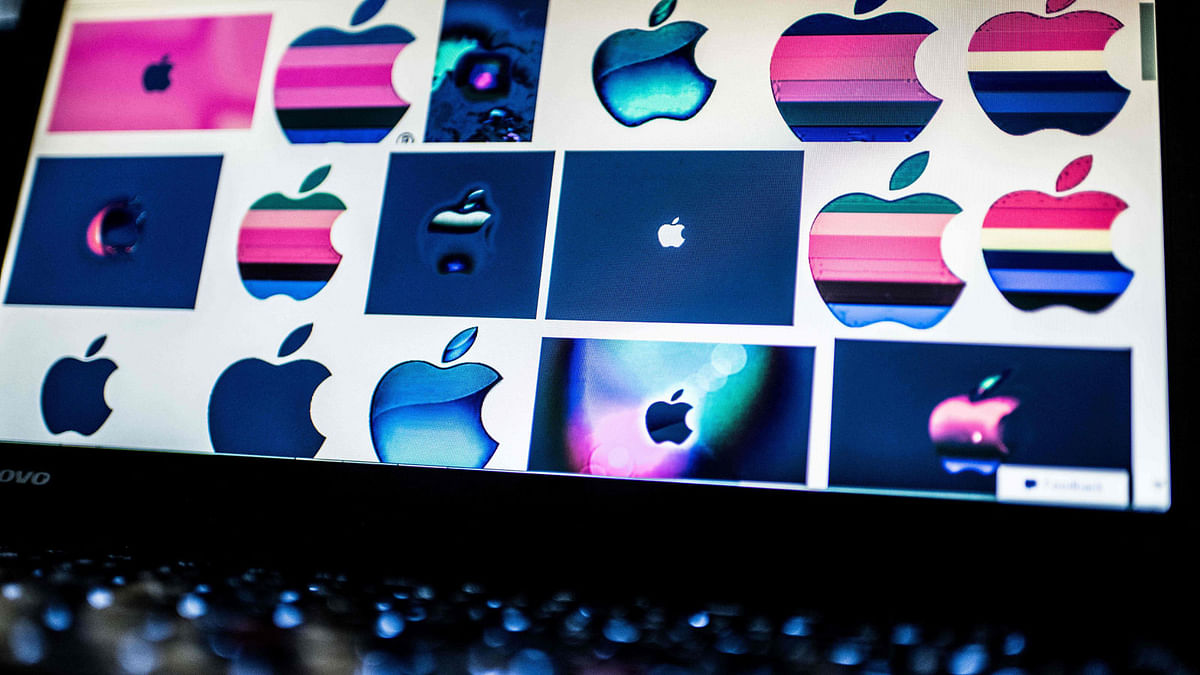 In this file photo taken on 23 March 2018 shows Apple logos on a computer screen in Beijing. AFP