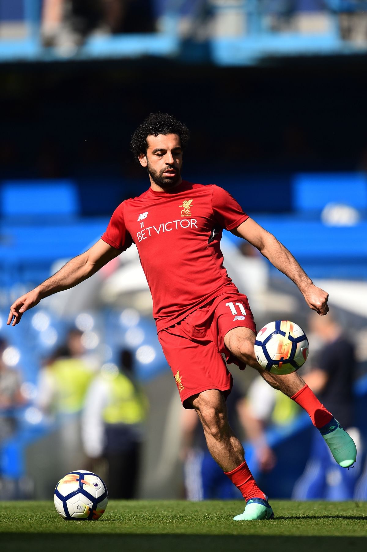 Liverpool's Egyptian midfielder Mohamed Salah warms up before the English Premier League football match between Chelsea and Liverpool at Stamford Bridge in London on 6 May, 2018. Photo: AFP