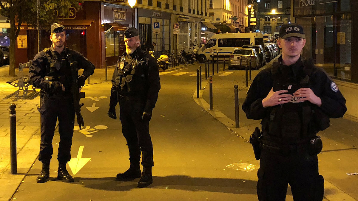 French police secure a street after a man killed a passer-by in a knife attack in the heart of Paris and injured four others before being shot dead by police, according to French authorities in Paris, France, on 12 May 2018. Reuters