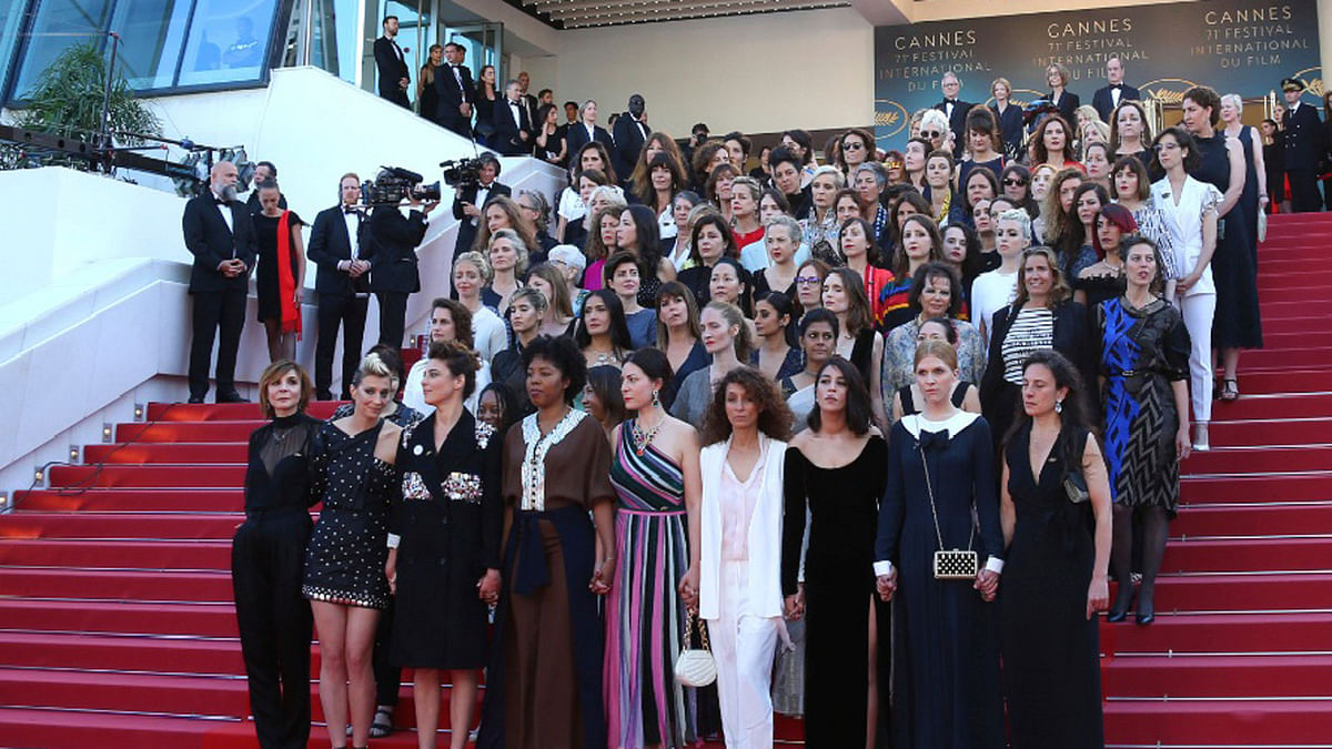 Eighty two film industry professionals stand on the steps of the Palais des Festivals to represent, what they describe as pervasive gender inequality in the film industry, at the 71st international film festival, Cannes, southern France on 12 May.