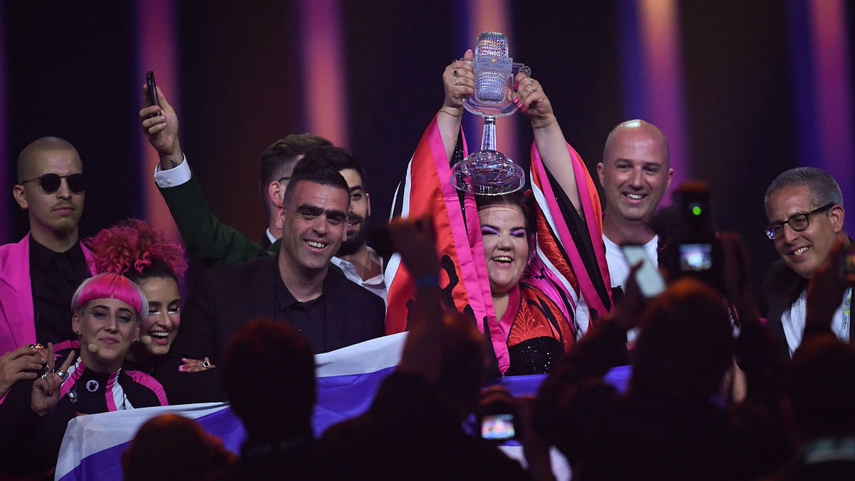 Israel`s singer Netta Barzilai aka Netta celebrates with the trophy after winning the final of the 63rd edition of the Eurovision Song Contest 2018 at the Altice Arena in Lisbon, on 12 May 2018. AFP