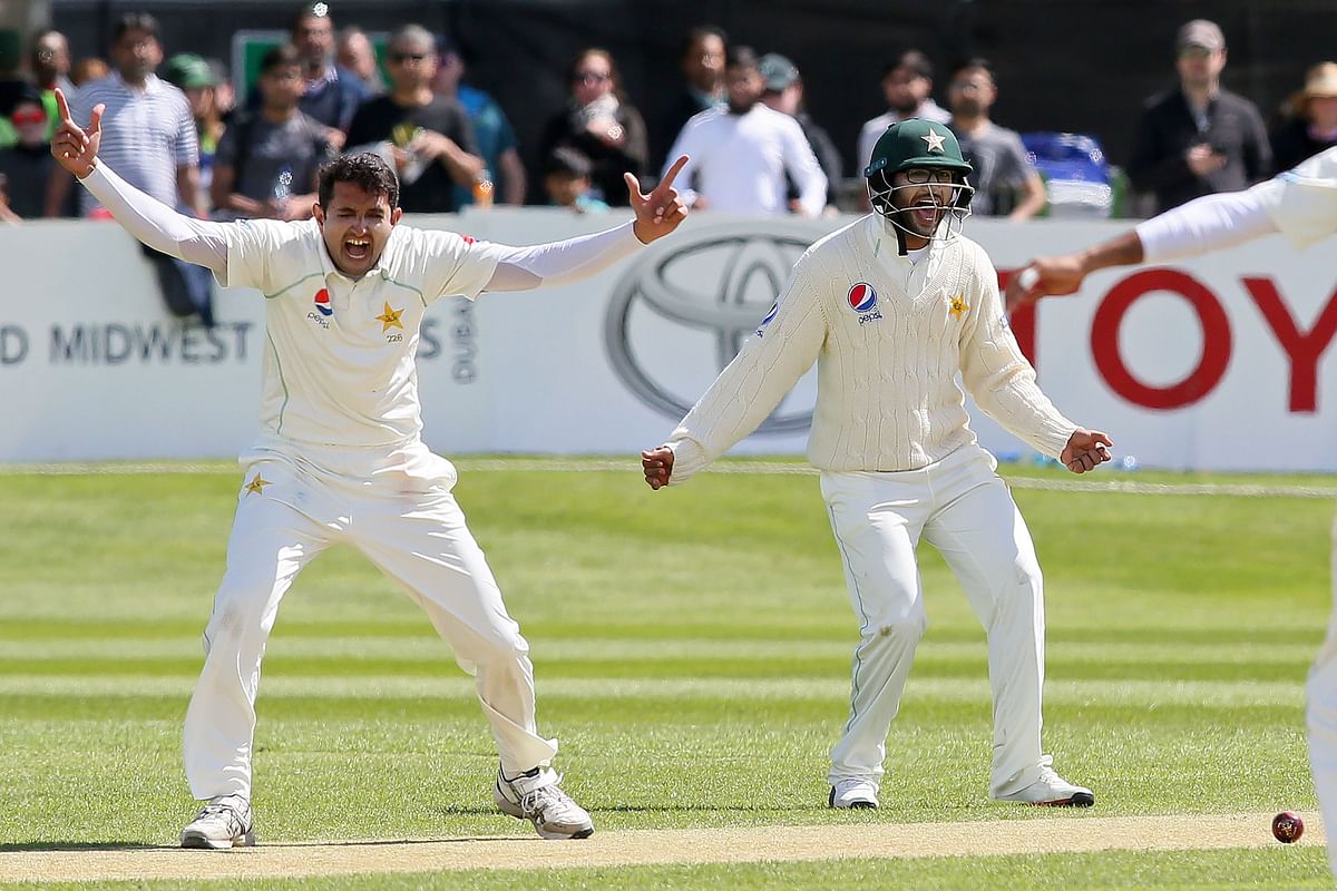 Pakistan`s Mohammad Abbas (L) celebrates after trapping Ireland`s Ed Joyce leg before wicket (LBW) during play on day three of Ireland`s inaugural test match against Pakistan at Malahide cricket club, in Dublin on 13 May, 2018. Photo: AFP