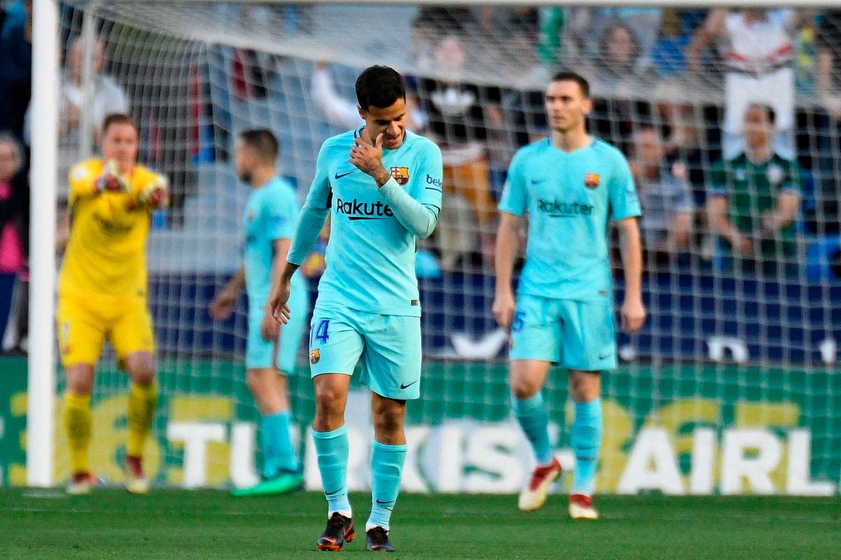 Barcelona’s Brazilian midfielder Philippe Coutinho gestures after a Levante goal during the Spanish league football match between Levante and Barcelona at the Ciutat de Valencia stadium in Valencia on 13 May. Photo: AFP  Barcelona’s unbeaten season ended by five-star Levante