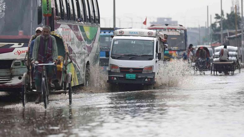 Vehicles make way in the rainwater clogged road of Jatrabari, Dhaka on 13 May. The photo was taken by Tanvir Ahammed