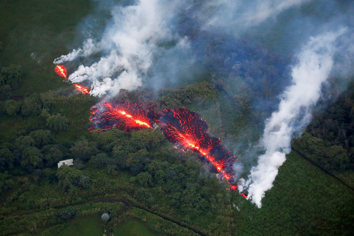 Lava erupts from a fissure east of the Leilani Estates subdivision during ongoing eruptions of the Kilauea Volcano in Hawaii, US, 13 May 2018. Reuters