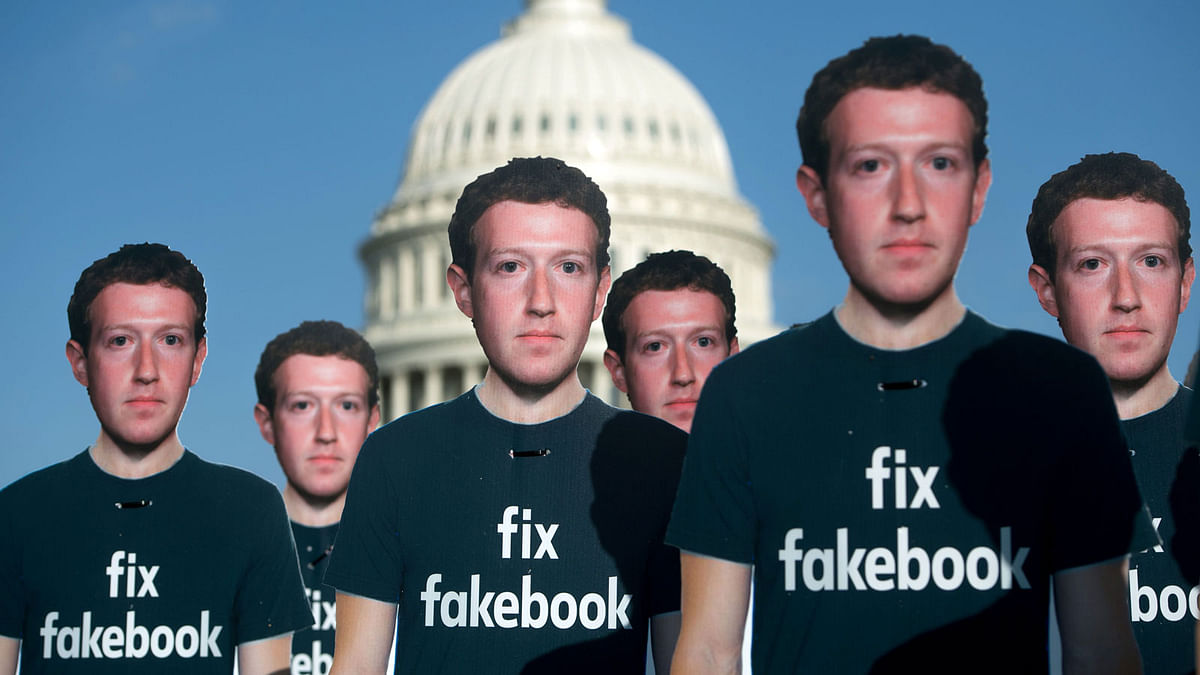 In this file photo taken on 10 April, 2018, one hundred cardboard cutouts of Facebook founder and CEO Mark Zuckerberg stand outside the US Capitol in Washington, DC. Photo: AFP