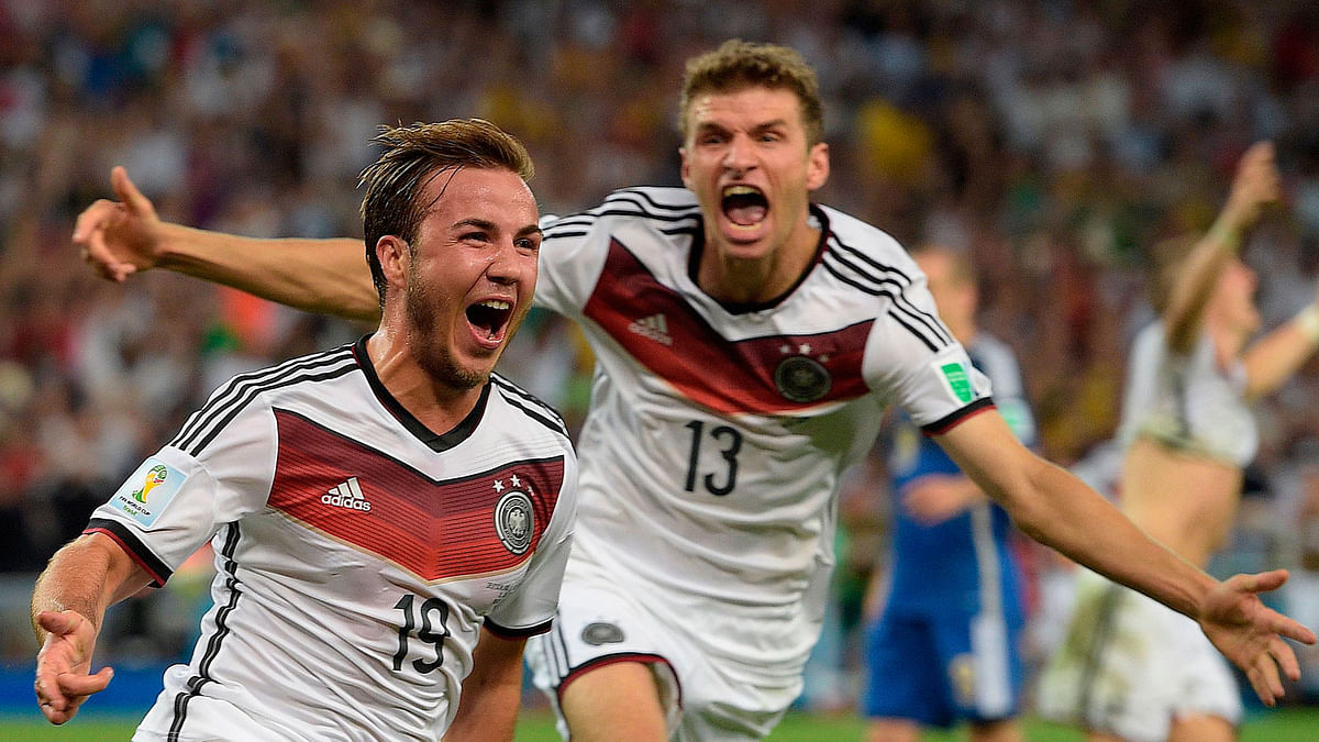 Goetze (L) celebrates with Thomas Mueller after scoring the winner in the 2014 World Cup final. AFP