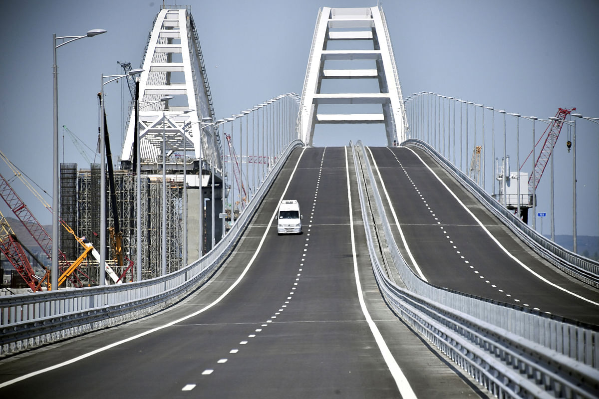 A vehicle drives along a bridge, which was constructed to connect the Russian mainland with the Crimean Peninsula across the Kerch Strait, on 15 May 2018. Photo: Reuters