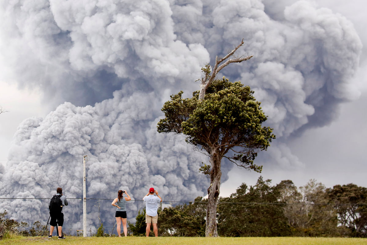 People watch as ash erupts from the Halemaumau crater near the community of Volcano during ongoing eruptions of the Kilauea Volcano in Hawaii, US on 15 May 2018. Photo: Reuters