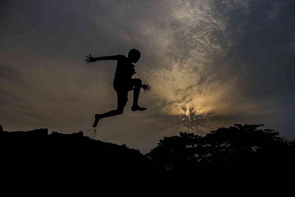 The picture of the boy playing in the twilight was taken by Saddam Hossain from Botiaghata, Khulna on 16 May