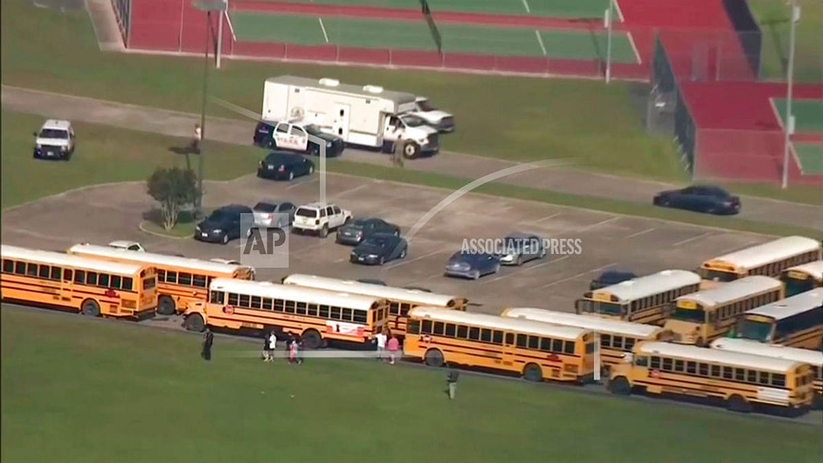 In this image taken from video law enforcement officers respond to a high school near Houston after an active shooter was reported on campus, Friday, 18 May 2018, in Santa Fe, Texas. The Santa Fe school district issued an alert Friday morning saying Santa Fe High School has been placed on lockdown. Photo: AP