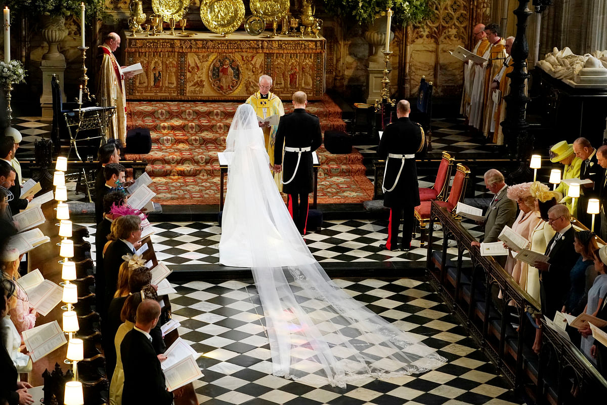 Prince Harry and Meghan Markle in St George`s Chapel at Windsor Castle during their wedding service, conducted by the Archbishop of Canterbury Justin Welby in Windsor, Britain, 19 May, 2018. Photo: Reuters