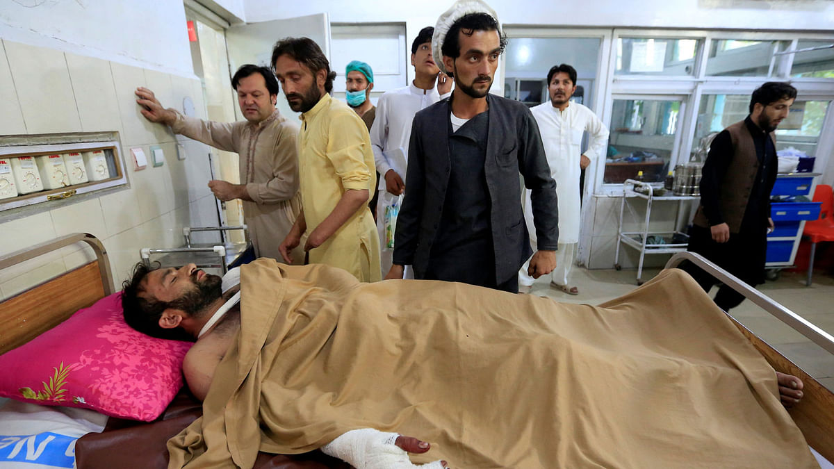 An injured man receives treatment in a hospital, after blasts at a sports stadium, in Jalalabad city, Afghanistan on 19 May. Photo: Reuters