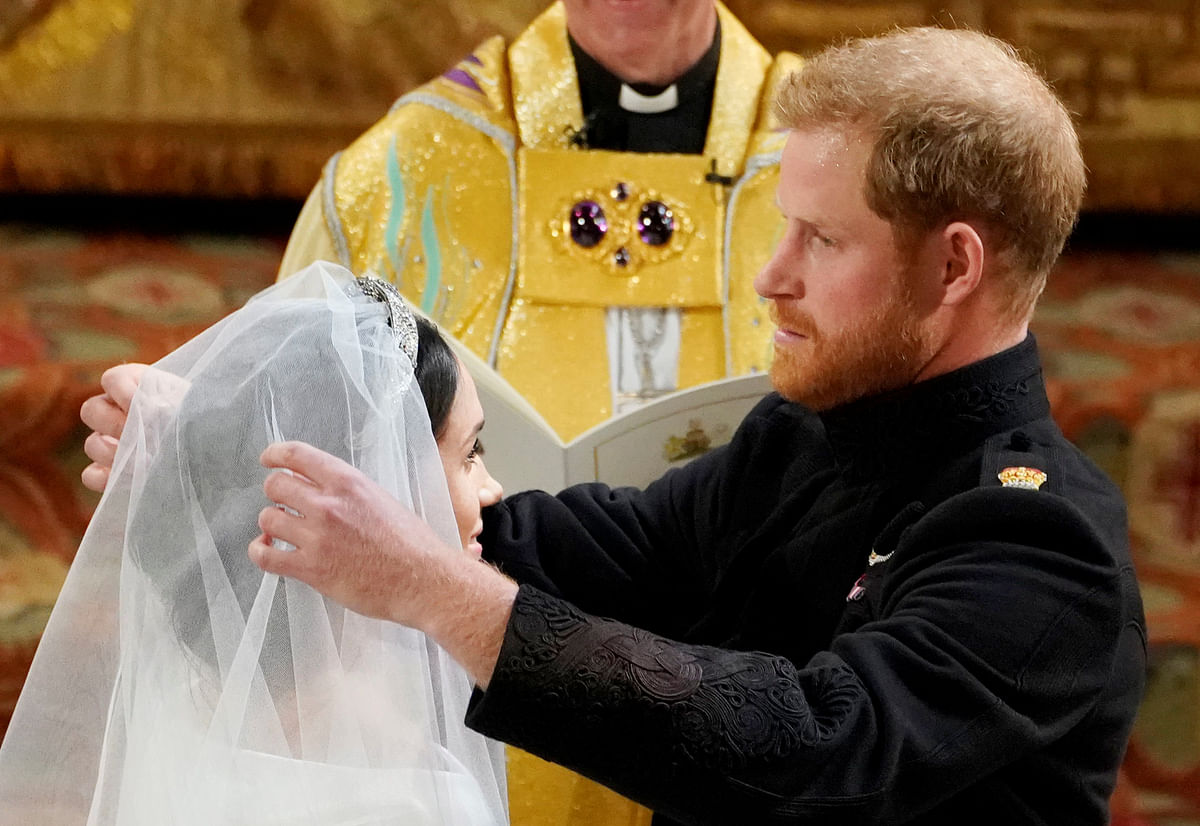 Prince Harry and Meghan Markle in St George`s Chapel at Windsor Castle during their wedding service in Windsor, Britain, 19 May, 2018. Photo: Reuters