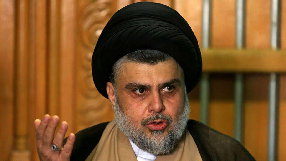 Iraqi Shi`ite cleric Moqtada al-Sadr speaks during a news conference with Iraqi politician Ammar al-Hakim, leader of the Hikma Current, in Najaf, Iraq on 17 May. Photo: Reuters