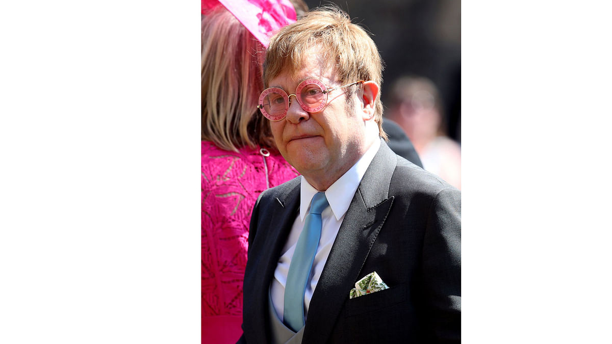 Elton John leaves St George`s Chapel at Windsor Castle after the wedding of Meghan Markle and Prince Harry. 19 May, 2018. Photo: Reuters