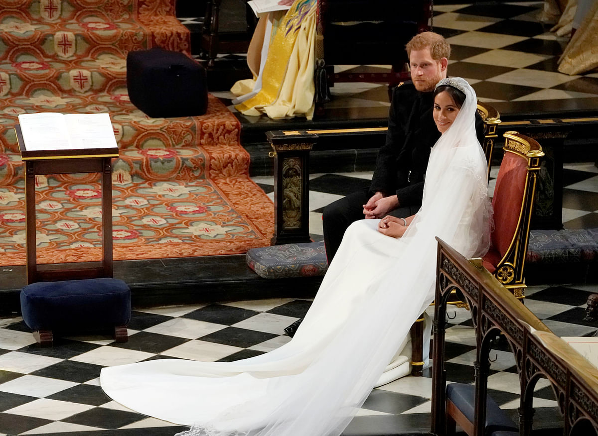 Prince Harry and Meghan Markle in St George`s Chapel at Windsor Castle during their wedding service in Windsor, Britain, May 19, 2018. Photo: Reuters