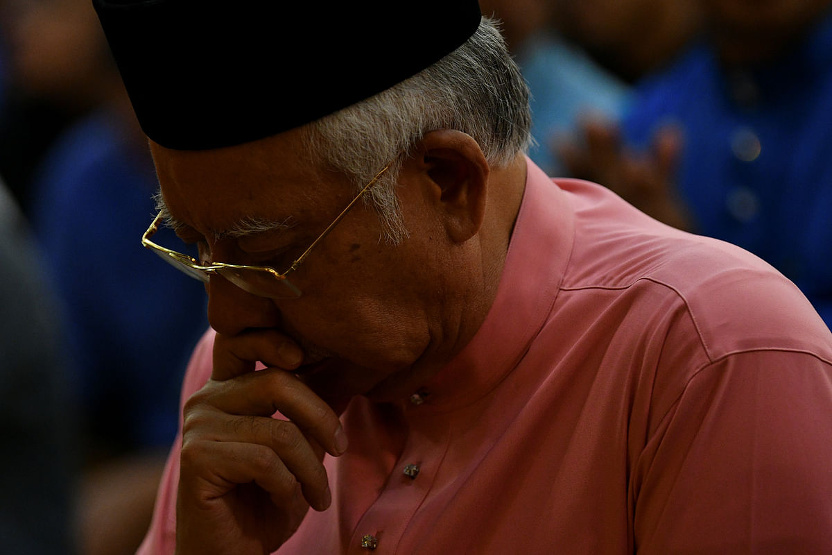 Malaysia’s former prime minister Najib Razak prays before he attends the United Malays National Organisation 72th anniversary celebrations in Kuala Lumpur, on 11 May 2018. Photo: Reuters