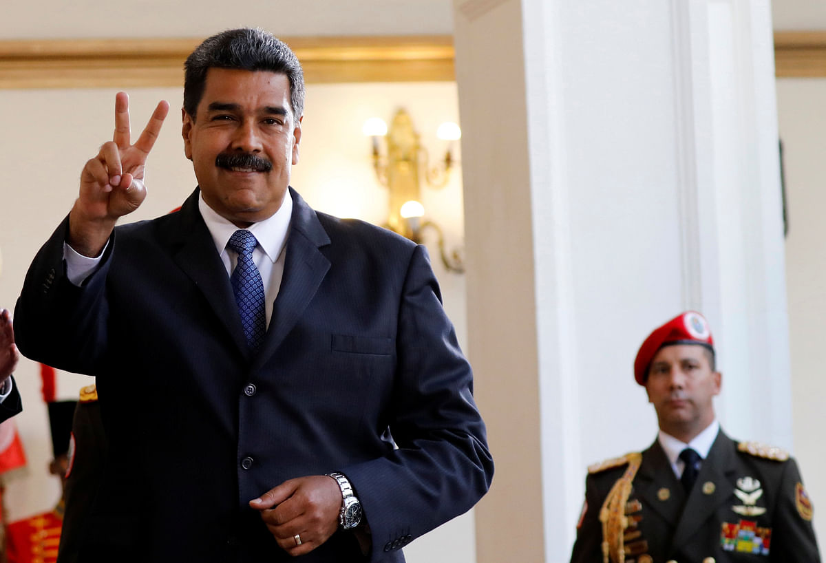 Venezuela`s president Nicolas Maduro smiles to the media after a meeting with former Spanish prime minister Jose Luis Rodriguez Zapatero at the presidential palace in Caracas, Venezuela on 18 May 2018. Photo: Reuters