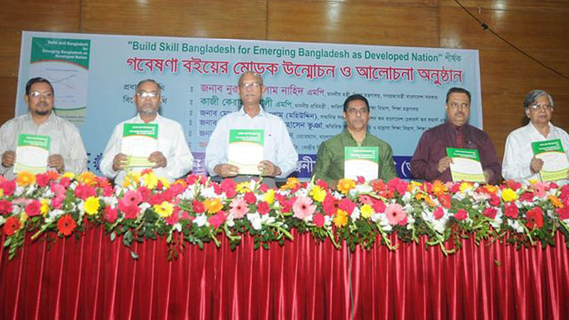 Guests holding the research anthology titled ‘Build Skilled Bangladesh for Emerging Bangladesh as Developed Nation’ which was unveiled at IDEB in the capital on Sunday. Photo: UNB