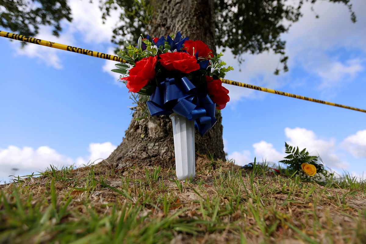 Flowers are left in memory of the victims killed in a shooting at the Santa Fe High School in Santa Fe, Texas, US on 19 May. Photo: Reuters