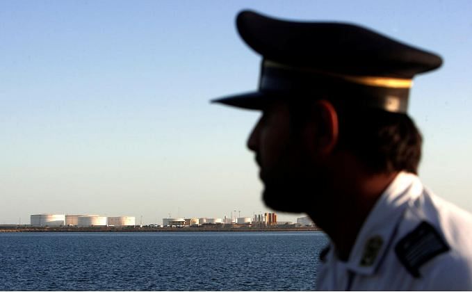 A security personnel looks on at oil docks at the port of Kalantari in the city of Chabahar, 300km (186 miles) east of the Strait of Hormuz, Iran on 17 January 2012. Reuters File Photo