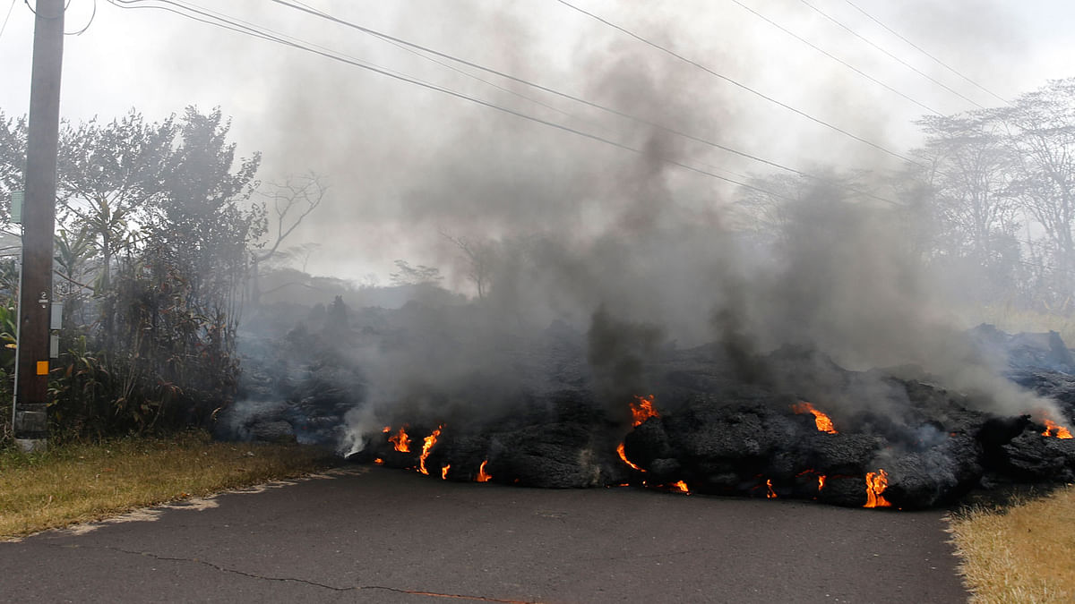 Lava crosses the road near Pohoiki Road on 18 May near Pahoa, Hawaii.