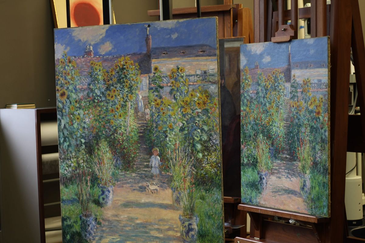 Two paintings by Claude Monet, both painted in 1881 and titled “The Artist’s Garden at Vetheuil” are seen unframed at the National Gallery of Art’s conservation laboratory in Washington on 17 May. Photo: AFP