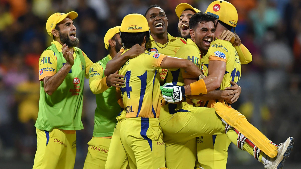 Chennai Super Kings cricketers celebrate after winning the 2018 Indian Premier League (IPL) Twenty20 first qualifier cricket match against Sunrisers Hyderabad at the Wankhede stadium in Mumbai on 22 May 2018. Photo: AFP