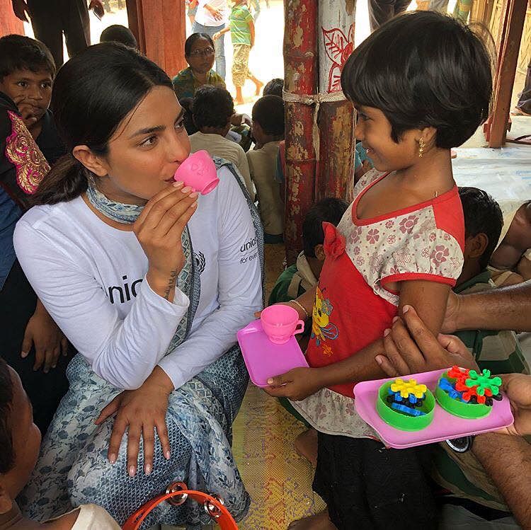 Priyanka Chopra making fun with a little Rohingya girl . Photo : facebook