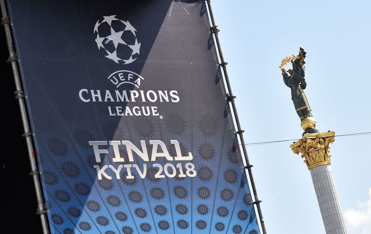 A placard bearing the logo of the UEFA Champions League Cup final is displayed at the fan zone in Kiev on 24 May, 2018, ahead of the 2018 UEFA Champions League Cup football match between Real Madrid and Liverpool FC next 26 May at the Olimpiyskiy Stadium. Photo: AFP