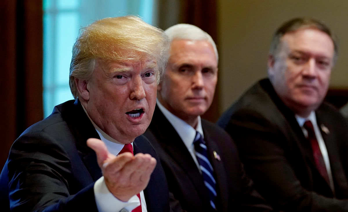 Vice president Mike Pence (C) and secretary of state Mike Pompeo listen as US president Donald Trump speaks during a meeting with NATO Secretary General Jens Stoltenberg at the White House in Washington on 17 May 2018. Reuters