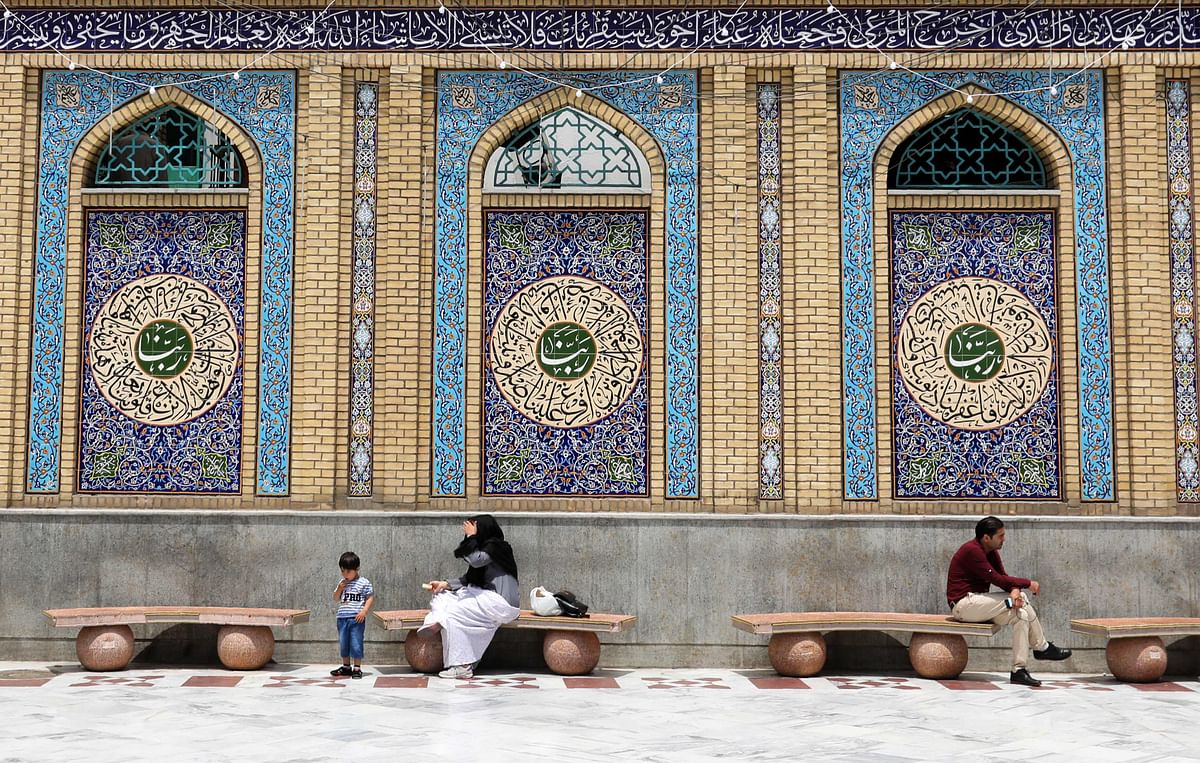 Iran Shiite Muslims sit at the Emamzadeh Saleh mosque in Tajrish square in northern Tehran on 22 May 2018, during the Muslim holy fasting month of Ramadan. Photo: AFP