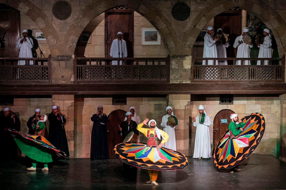 Egyptian dancers perform the Tanoura during the holy fasting month of Ramadan, at el-Ghuri culture Palace in Cairo on 22 May 2018. Photo: AFP