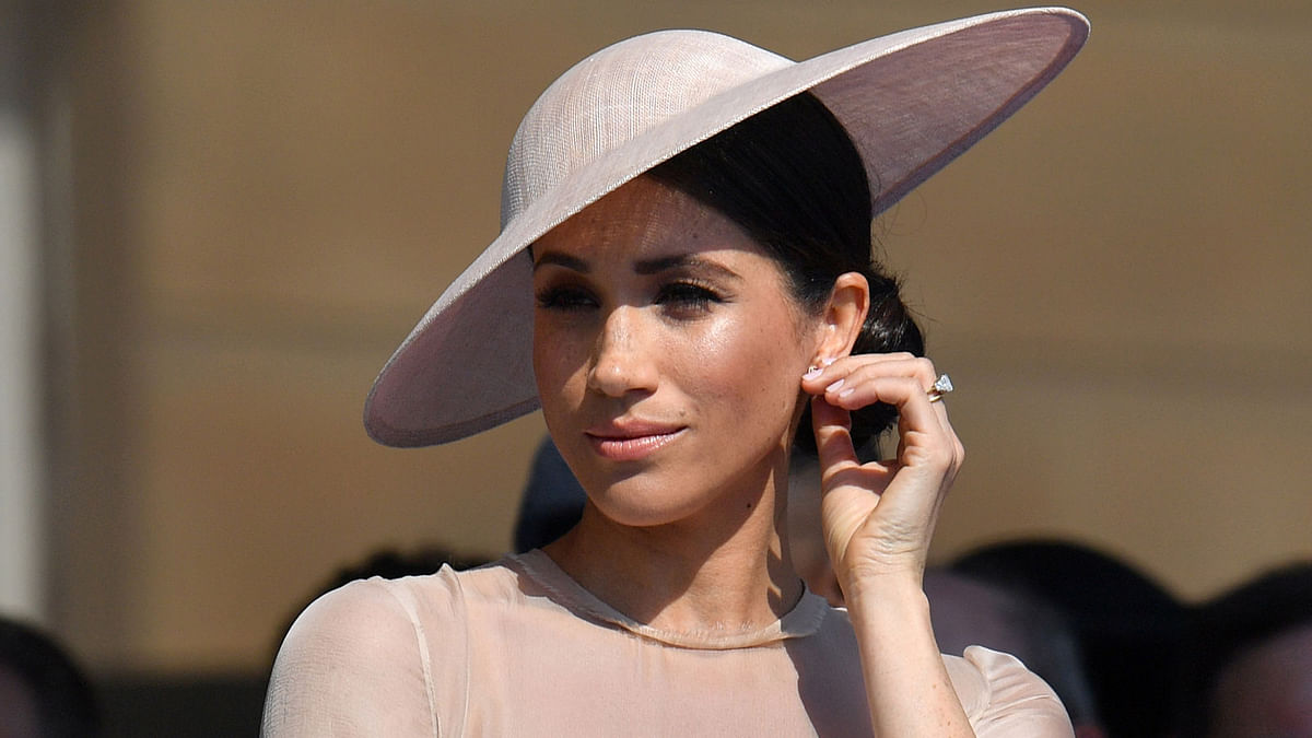 Meghan, Duchess of Sussex attends a garden party at Buckingham Palace, in London, Britain 22 May. Photo: Reuters