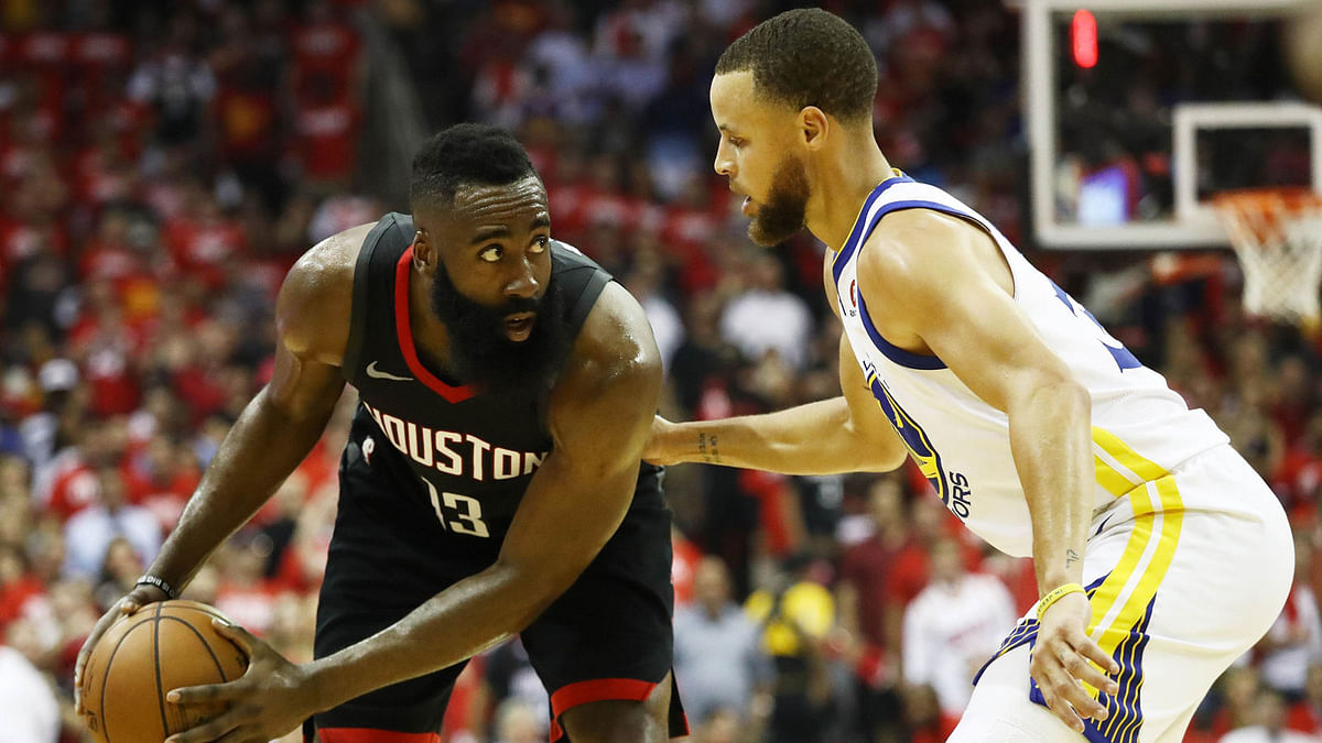 James Harden of the Houston Rockets drives against Stephen Curry of the Golden State Warriors in the first half of Game Five of the Western Conference Finals of the 2018 NBA Playoffs at Toyota Center in Houston, Texas on Thursday. AFP