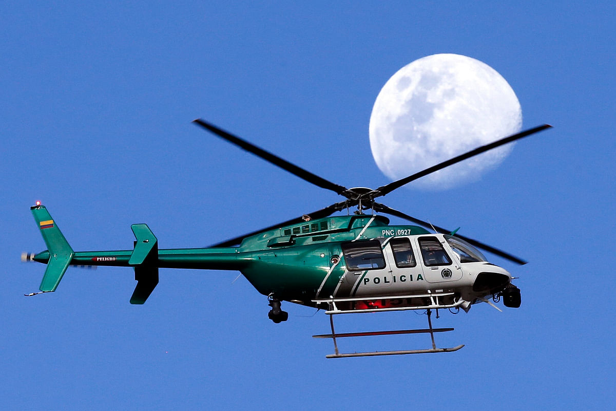 A police helicopter flies over the Nemesio Camacho stadium in Bogota, Colombia, prior to an exhibition match of the Colombian national soccer team on 25 May. Photo: AP