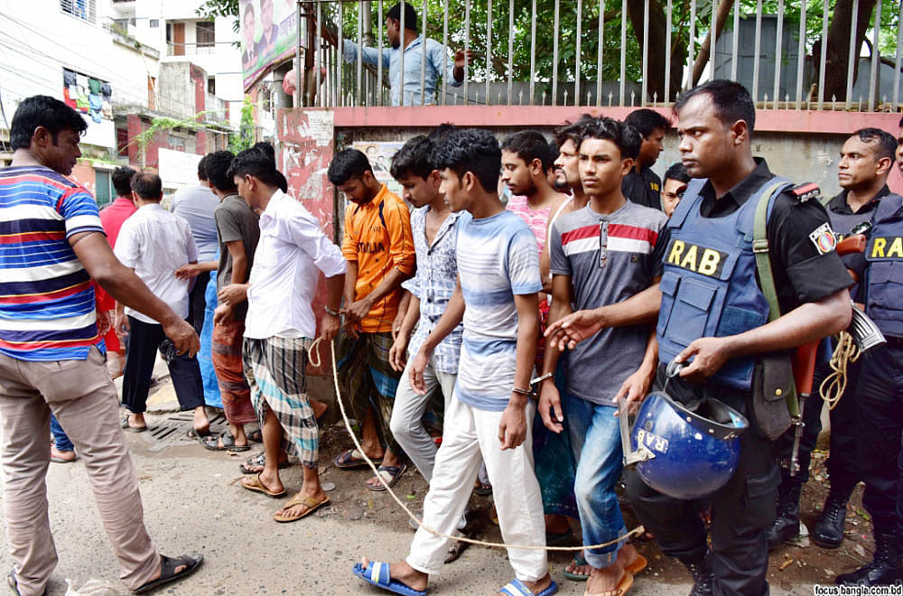RAB detains around 100 people from capital’s Mohammadpur Geneva Camp on Saturday. Photo: Focus Bangla