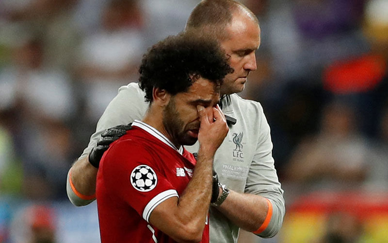 Liverpool`s Mohamed Salah looks dejected as he is substituted off due to injury. Photo:  Reuters