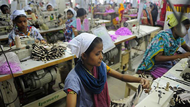Bangladeshi women are working in a garments factory in Dhaka. File Photo :  AFP