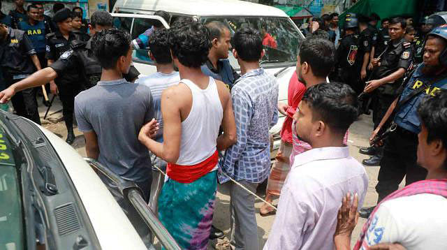 RAB detains around 153 people from capital’s Mohammadpur Geneva Camp on Saturday. Photo: Shuvra Kanti Das