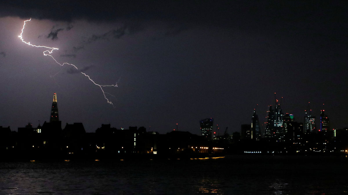 General view as lightning strikes over the city of London, Britain on 26 May 2018. Photo: Reuters